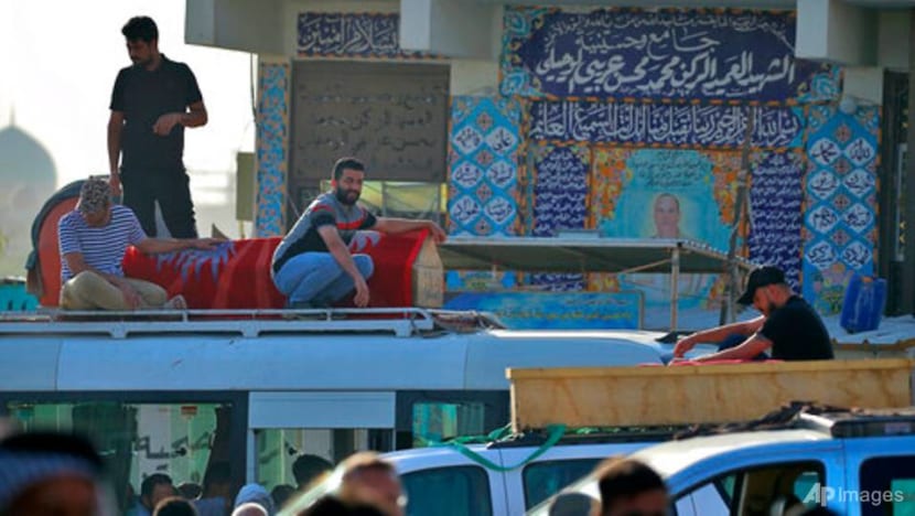 Families lay loved ones to rest after deadly Baghdad blast