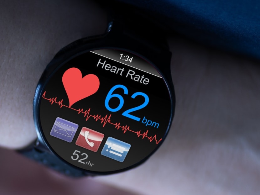A person's heart rate at rest being displayed on a smartwatch. A person's heart rate at rest being displayed on a smartwatch.