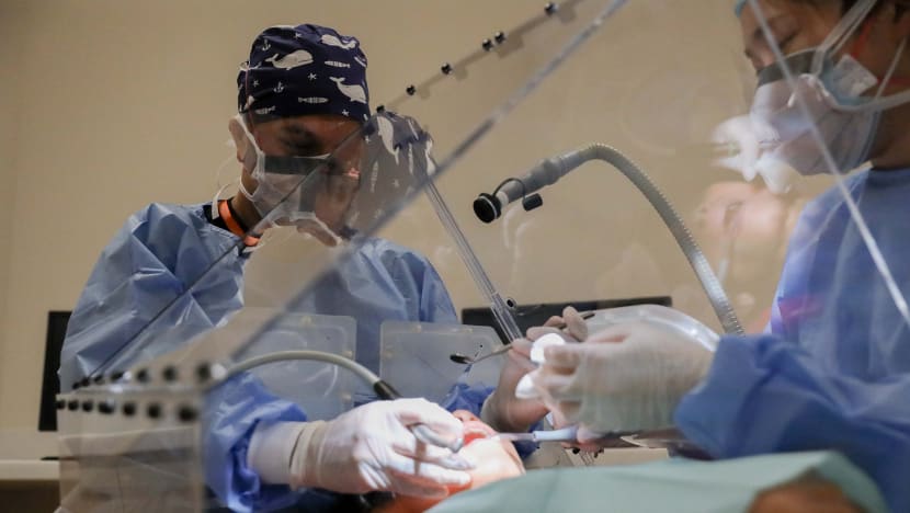 NUS researchers invent shield to limit spread of infectious diseases such as Covid-19 in dental procedures