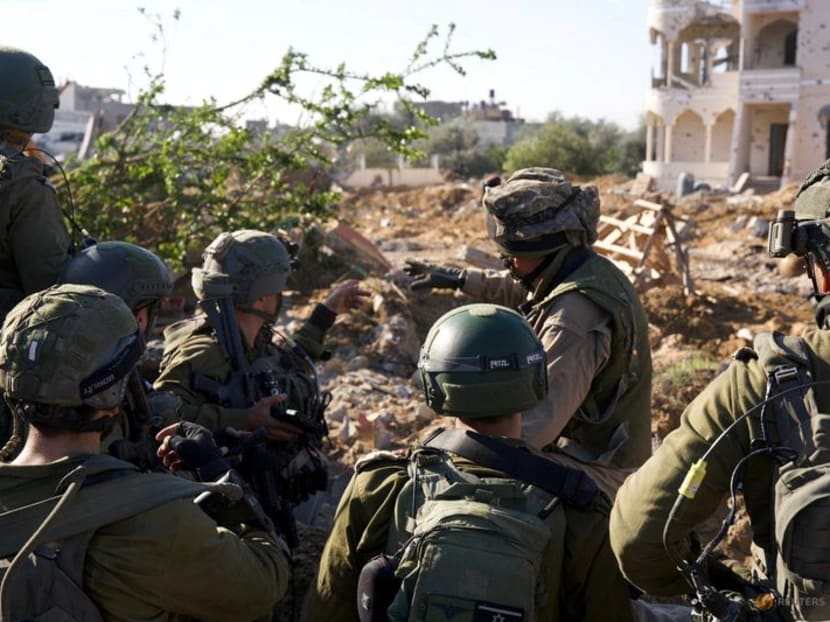 Israeli soldiers operate in the Gaza Strip amid the ongoing conflict between Israel and the Palestinian Islamist group Hamas, in this undated handout picture released on Feb 24, 2024. 