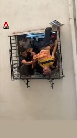 Sleeping man who fell from 10th floor flat in India rescued after getting caught in grilles
