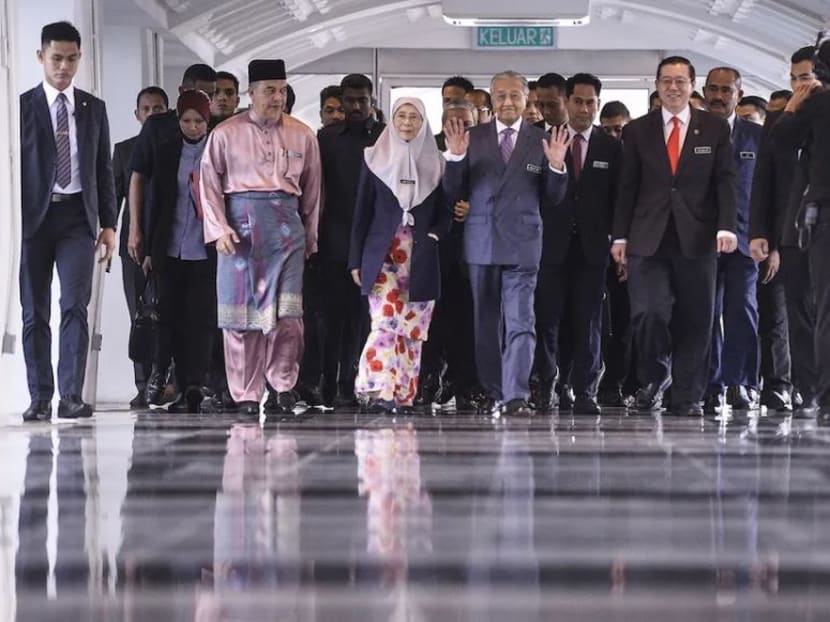 Malaysian prime minster Tun Dr Mahathir Mohamad, the country's deputy prime minister Datuk Seri Dr Wan Azizah Wan Ismail and finance minister Lim Guan Eng arrive in Parliament for the tabling of Budget 2020 on October 11, 2019.