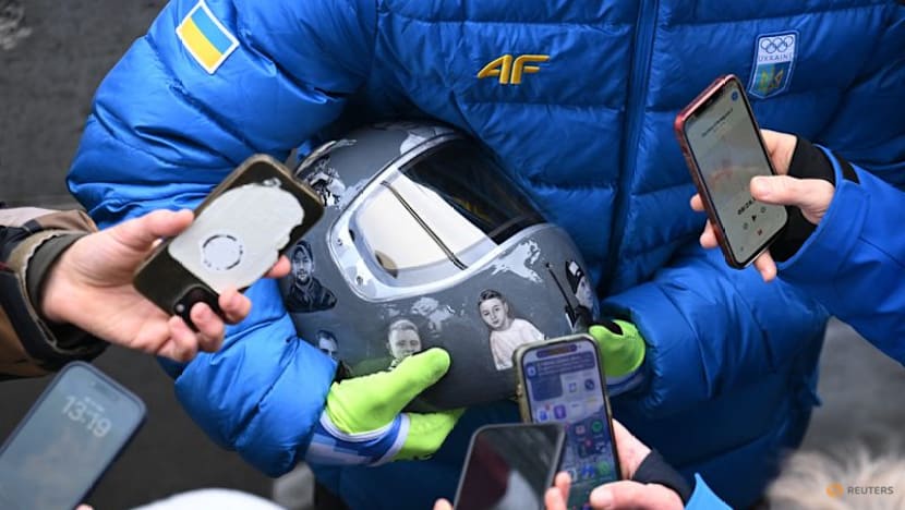 IOC 'begs' defiant Ukrainian to race without war dead helmet