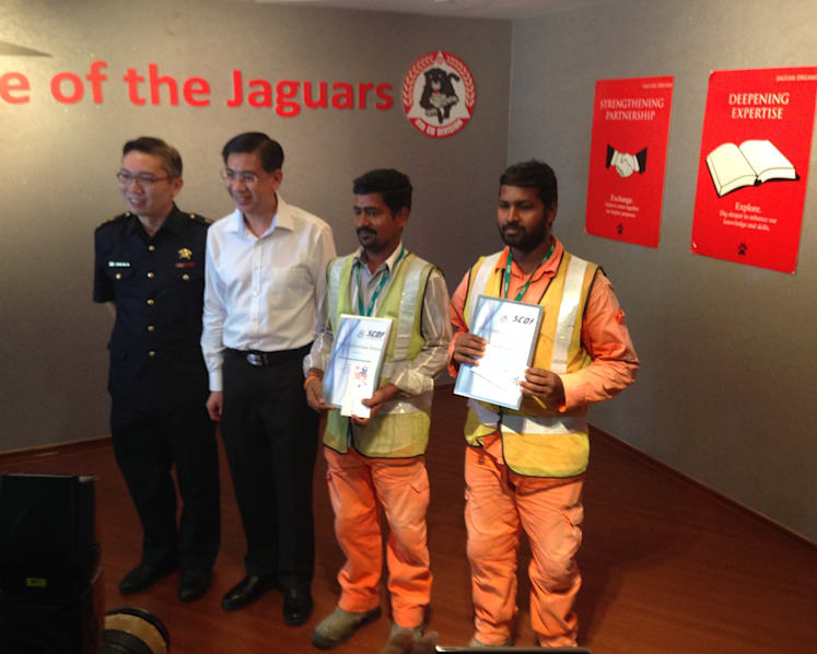 Duo lauded for rescuing toddler from second-storey ledge