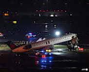 Both pilots killed after passenger jet hits ground truck at New York's LaGuardia airport