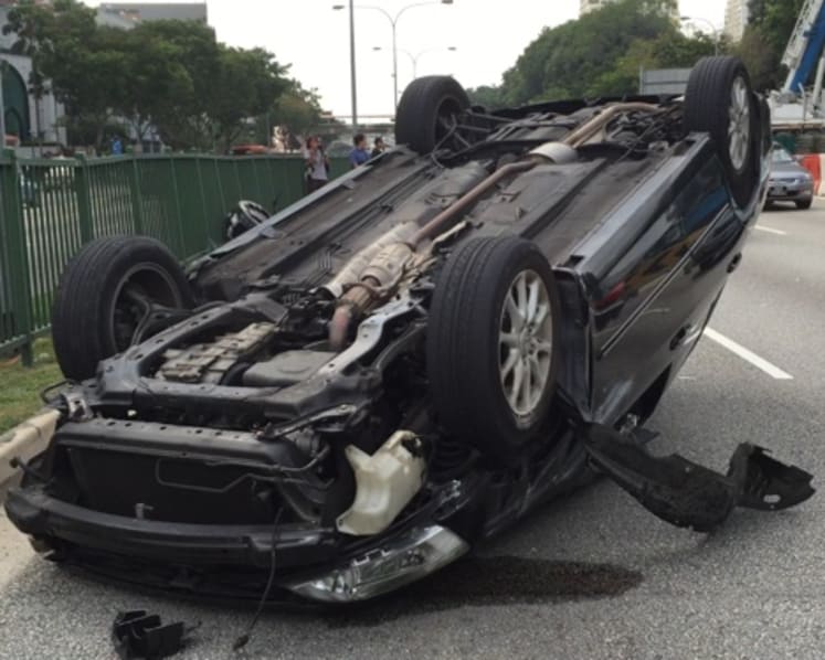 Car overturns after accident on Braddell Road
