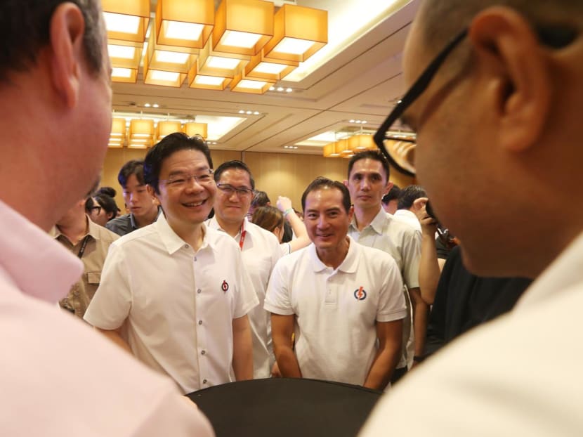Prime Minister Lawrence Wong (left) at the Refresh PAP event at Marina Bay Sands on June 8, 2024. Prime Minister Lawrence Wong (left) at the Refresh PAP event at Marina Bay Sands on June 8, 2024.