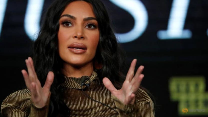 How is Kim Kardashian greeting other people now that she can’t shake hands?