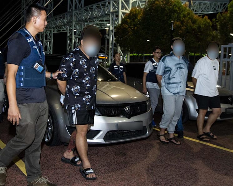 Three Malaysians extradited to Singapore over 'fake friend' scams