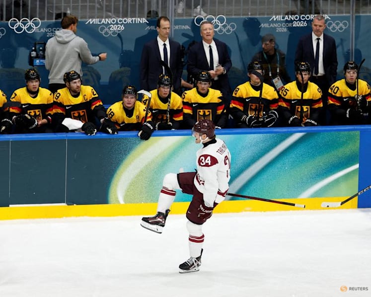 Ice hockey-Slovakia win group, US beat Denmark, Finland, Latvia notch wins