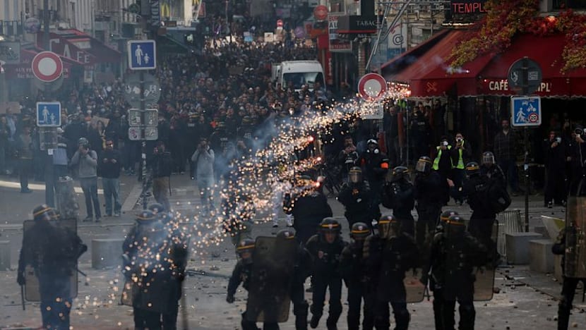 French police clash with protesters as tens of thousands rally over cost of living