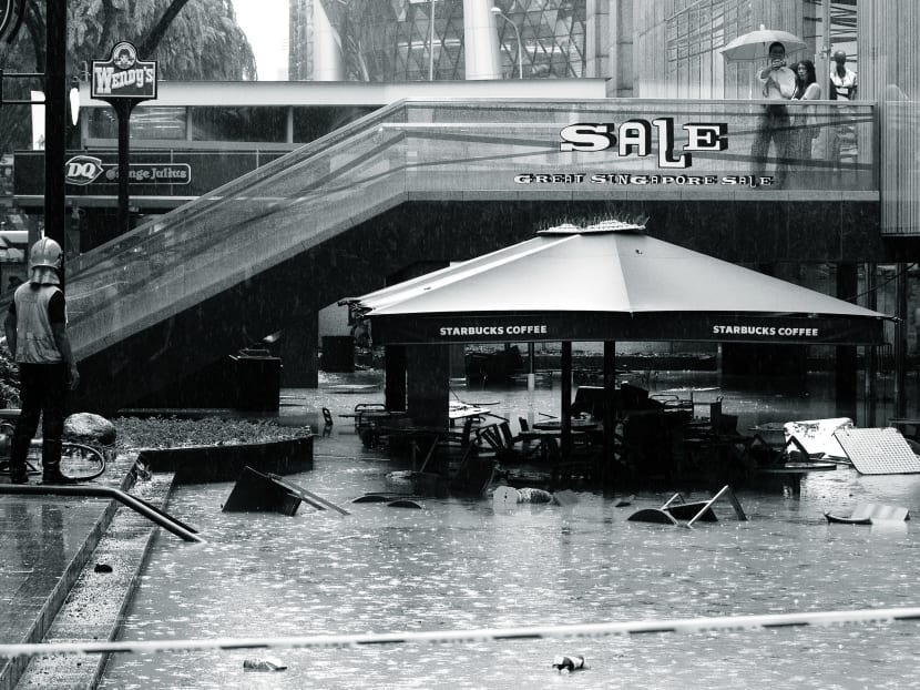 Informed discussion will enable Singaporeans and their leaders to make hard decisions easier: People may consider the benefit of water security for their children to outweigh the cost of occasional flash floods to themselves. Photo: Reuters