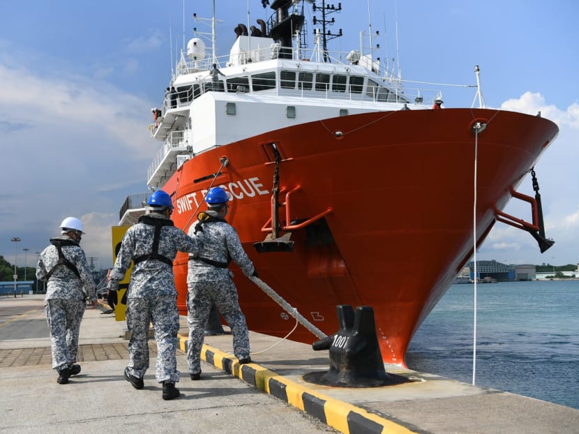Personnel from the Republic of Singapore Navy cast off the lines for the MV Swift Rescue.