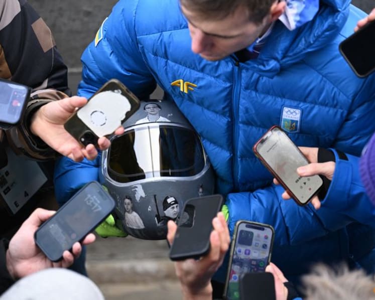 IOC 'begs' defiant Ukrainian to race without war dead helmet
