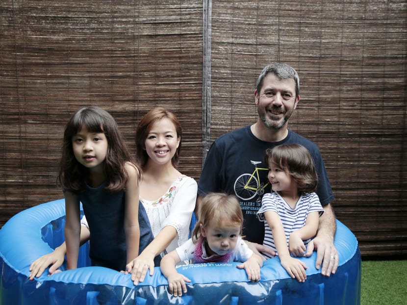 Ms Diana Chen, her husband Ashley Robinson and their children (L-R) Jemimah, 9, Samuel, 16 months, and Matilda, 4, pose for a photo in the inflatable birthing tub that Diana used. Photo: Jason Quah/TODAY Ms Diana Chen, her husband Ashley Robinson and their children (L-R) Jemimah, 9, Samuel, 16 months, and Matilda, 4, pose for a photo in the inflatable birthing tub that Diana used. Photo: Jason Quah/TODAY