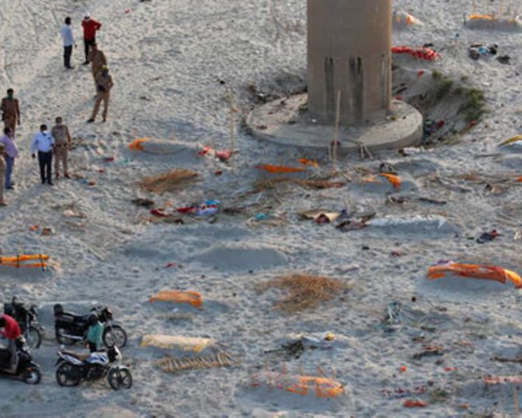 Indian police find bodies on riverbank amid raging COVID-19