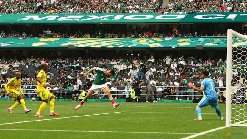 Mexico get World Cup party started with 2-0 win over nine-man South Africa