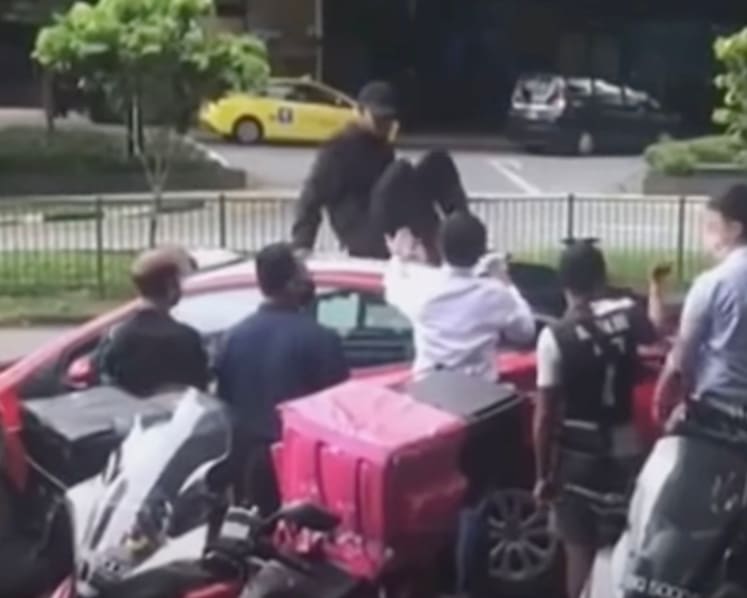 Man jailed after jumping onto moving taxi with estranged wife inside, sitting on its roof