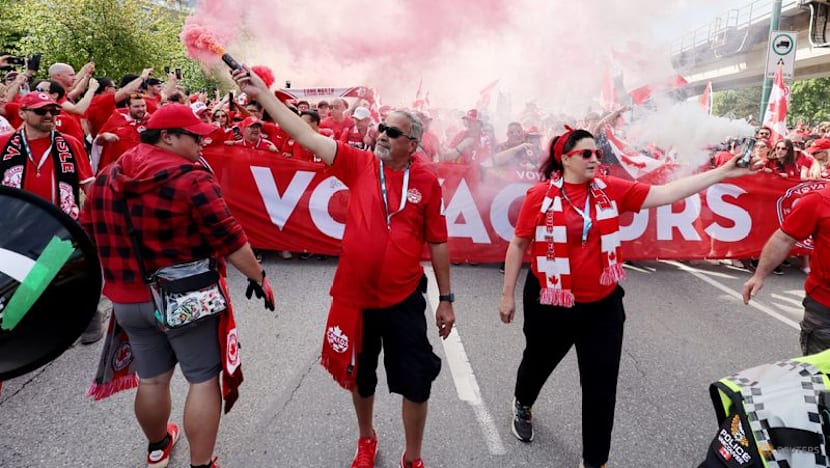 Canada fans on the march turn Vancouver into sea of red and white