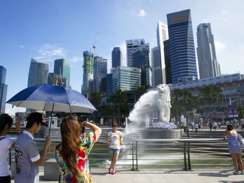 Tourists at Merlion Park. The current growth in visitor arrivals is unlikely to offset the increase in room supply within the short to medium term. Photo: Reuters Tourists at Merlion Park. The current growth in visitor arrivals is unlikely to offset the increase in room supply within the short to medium term. Photo: Reuters