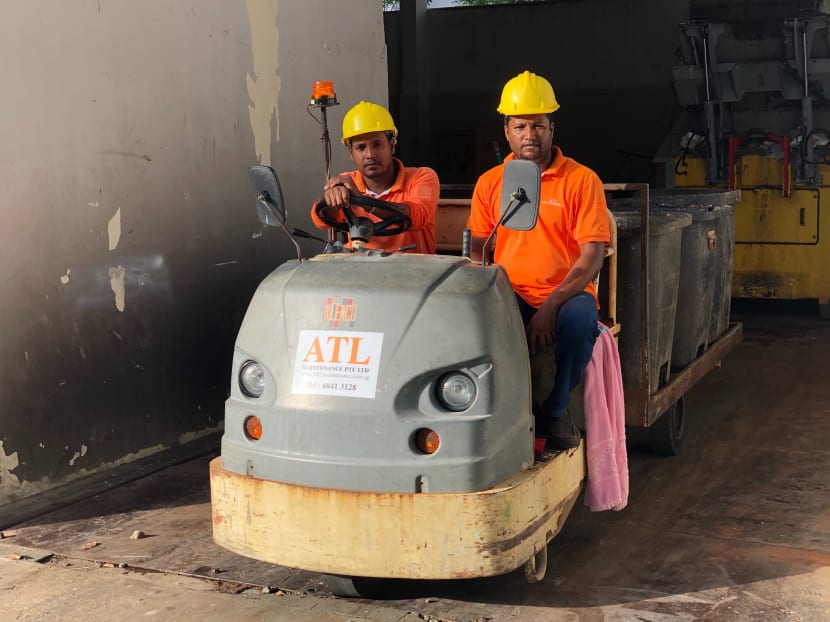 Town council cleaner Patwari Shamin, 24, (left) and his colleague Mr Mostafa Kamal, 37. Mr Shamin was driving a buggy loaded with chute bins when he heard soft cries coming from the back of the vehicle.