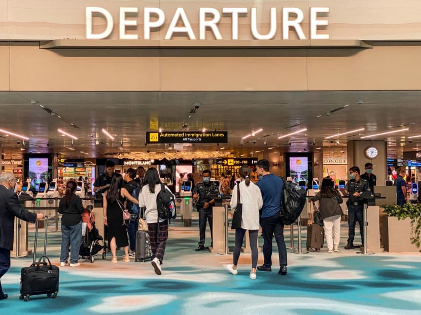 Travellers at a departure hall in Changi Airport on March 31, 2023.