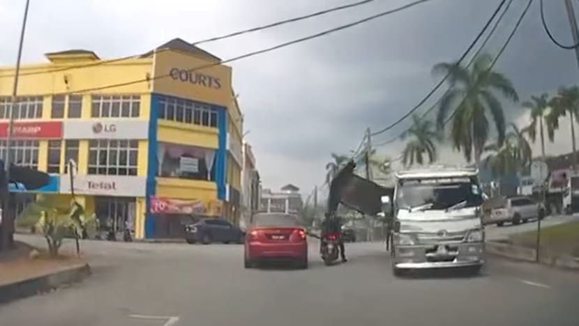 Motorcyclist injured by burger stall falling from moving lorry in Malaysia