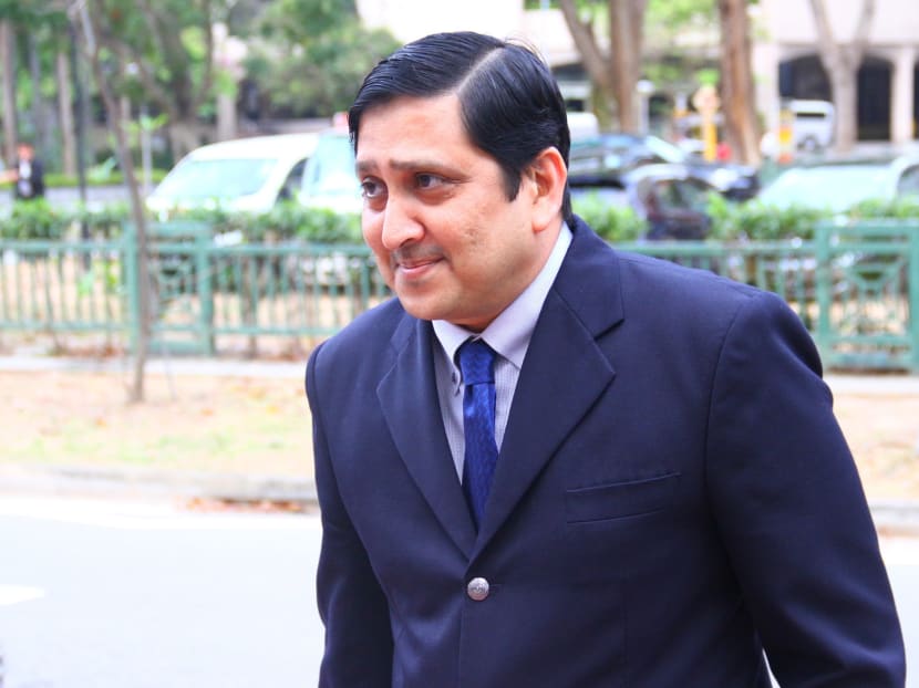 Director of Investigation at the Central Narcotics Bureau Adam Fashe Huddin, leaving the State Courts after giving evidence at the Little India riot COI hearing on March 26, 2014. Photo: Ernest Chua.