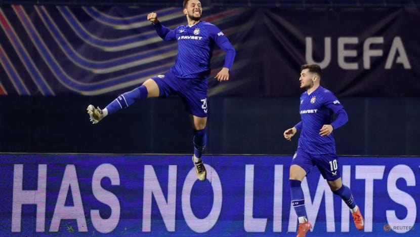 Ten-man Milan settle for playoff spot after Dinamo loss