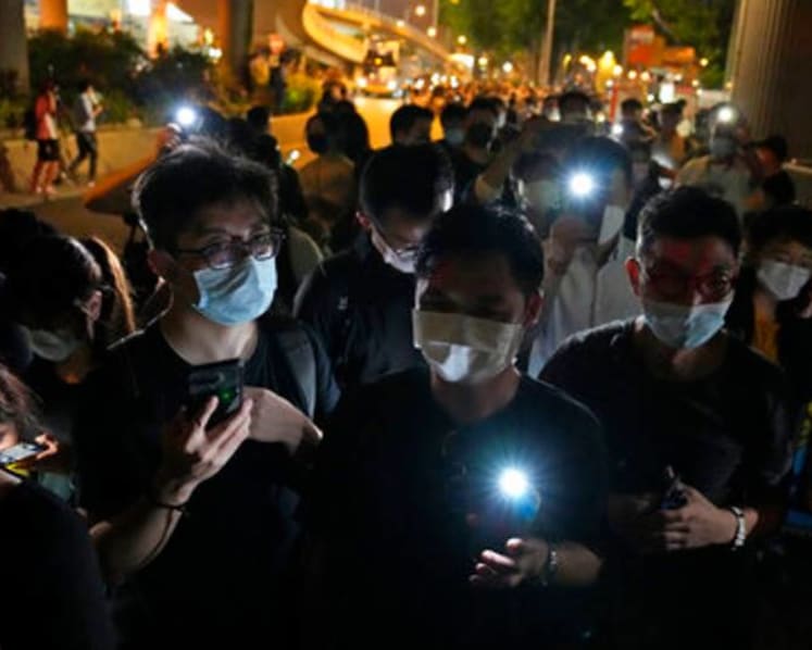 Hong Kong pro-democracy group downsizes amid crackdown