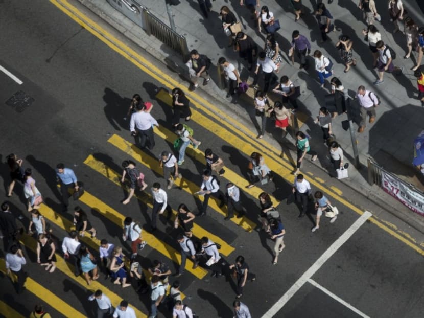 South Korea’s parliament on Wednesday (Feb 28) approved a bill to lower the limit on weekly work hours to 52 from 68, following years of battle among lawmakers, labor unions and businesses. Photo: Bloomberg South Korea’s parliament on Wednesday (Feb 28) approved a bill to lower the limit on weekly work hours to 52 from 68, following years of battle among lawmakers, labor unions and businesses. Photo: Bloomberg