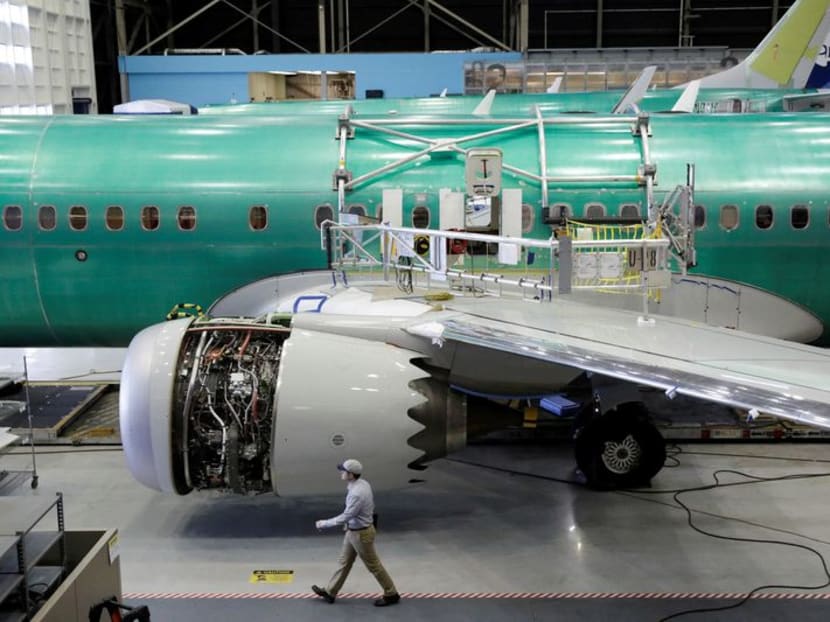 A worker walks past Boeing's new 737 MAX-9 under construction at their production facility in Renton, Washington, US, on Feb 13, 2017. 