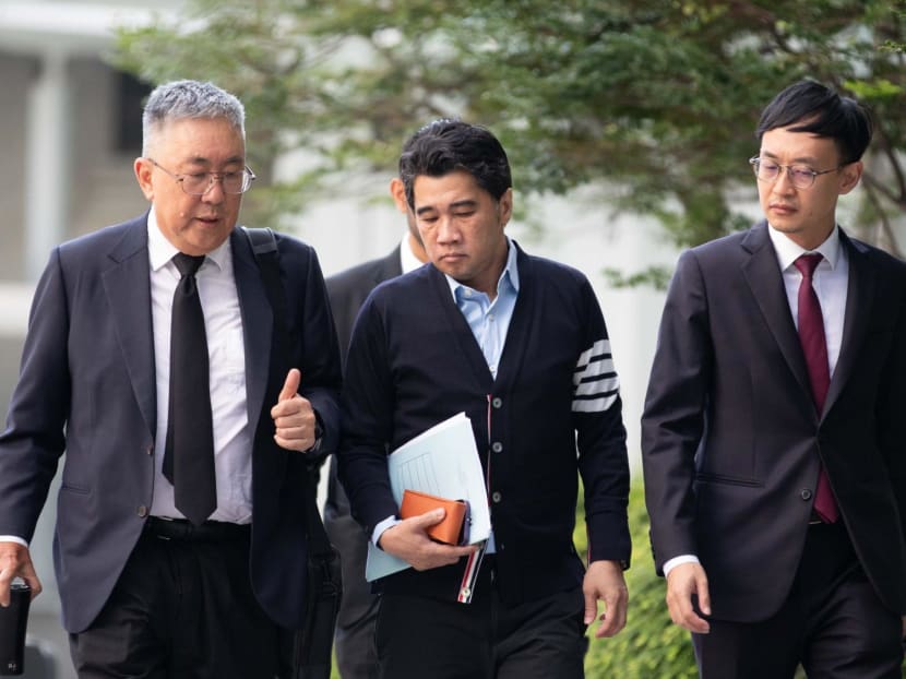 Ken Lim (centre) arriving at the State Courts on May 10, 2024.