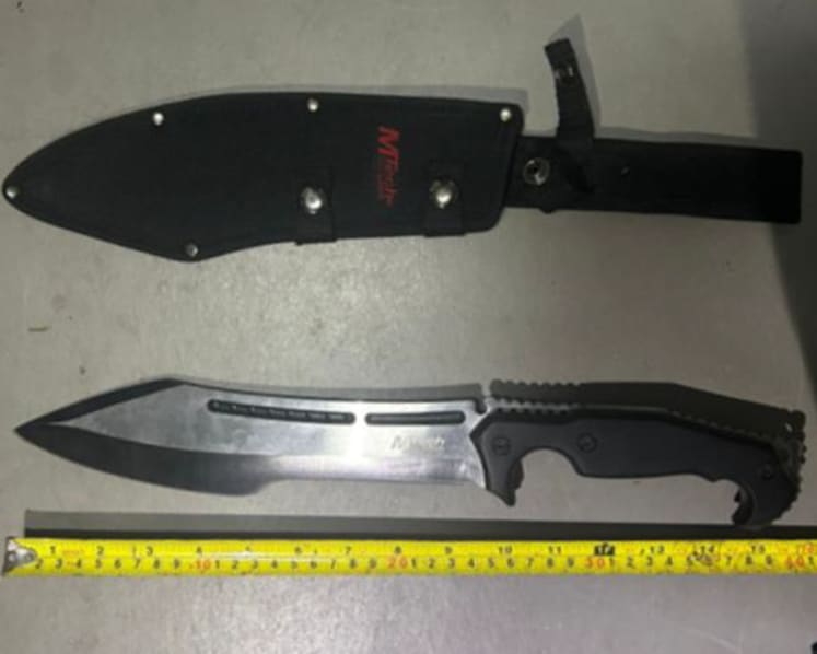 Drugs thrown out of building, 19-year-old with knife charges at CNB officer during raids