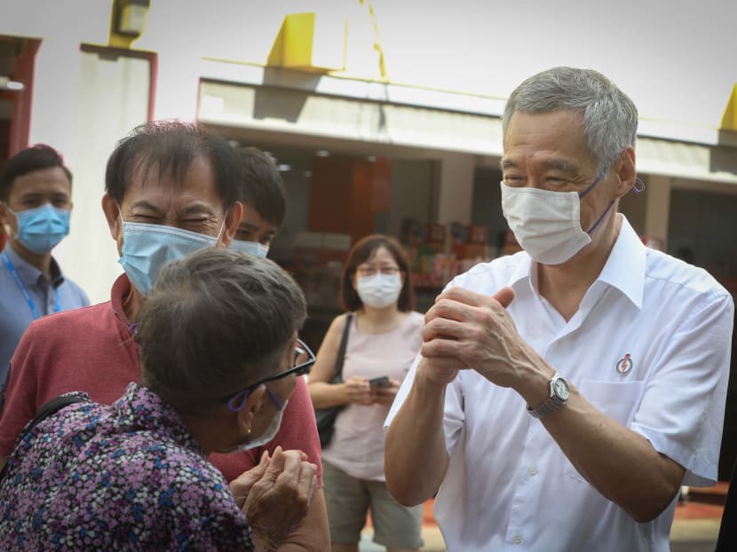 PM Lee, seen here on July 12, 2020, thanking residents in Ang Mo Kio Town Centre for their support in the General Election, says that PAP MPs may use social media to inform the public about their work and share their views, but that they must also be mindful of decorum and accuracy.