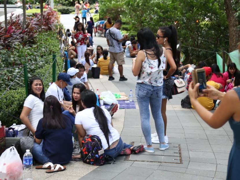 Foreign domestic workers spending time on Orchard Road before the coronavirus outbreak in Singapore. Foreign domestic workers spending time on Orchard Road before the coronavirus outbreak in Singapore.