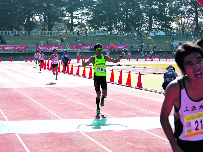 Mok crossing the finishing line at the Ageo City Half Marathon in Saitama yesterday. Photo: Brett Larner/ Japan Running News