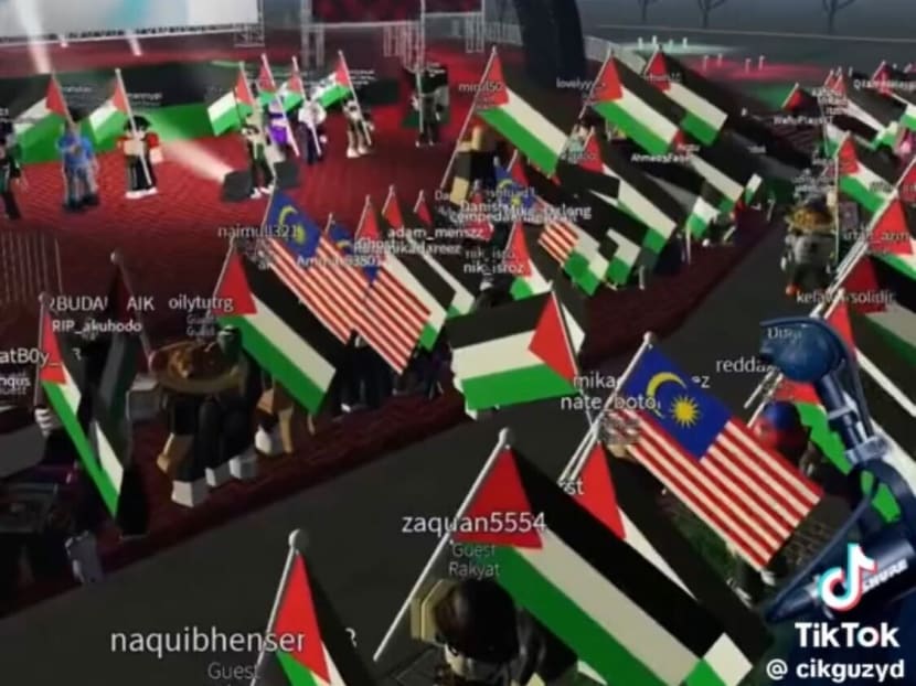 Roblox users are seen wielding a mix of Palestinian and Malaysian flags at a virtual Pro-Palestine protest organised on the platform by Malaysian content creator Afiq Mat Zaid.