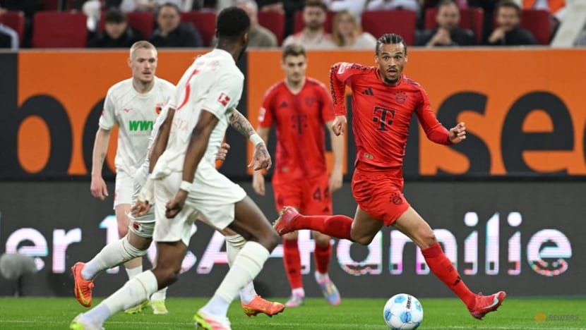 Bayern battle past 10-man Augsburg but Musiala goes off injured