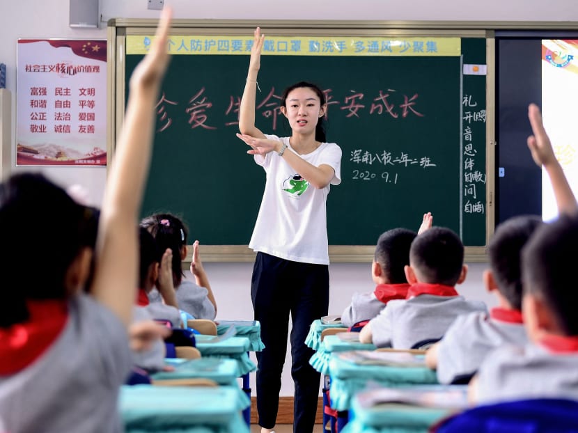 Elementary school students attend a class on the first day of the new semester in Shenyang in China's northeastern Liaoning province on Sept 1, 2020.