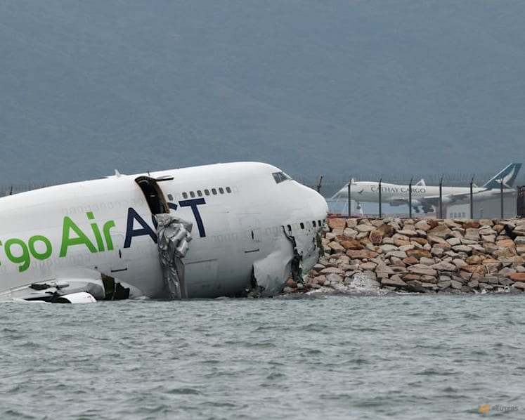 Cargo plane slides off runway in Hong Kong, killing two airport staff