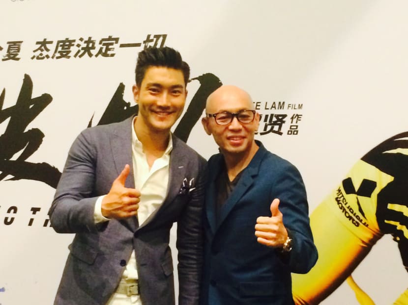 Korean heart-throb Choi Siwon and To The Fore director Dante Lam in Singapore to promote the movie. Photo: Genevieve Loh