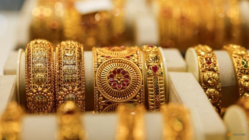 Gold slips as dollar firms, spotlight on Powell's Jackson Hole remarks