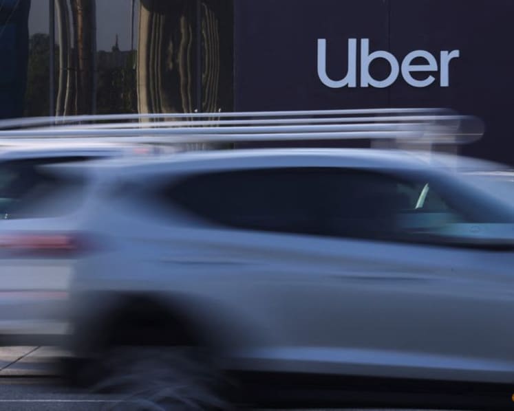 Uber pushes robotaxi plans even as cheaper rides, higher taxes dent profit