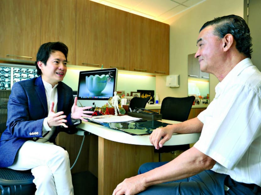 Thanks to targeted therapy from Dr Wong Seng Weng (left), colorectal cancer is now a distant memory for Mr Chah Meng Heng. Photo: Koh Mui Fong