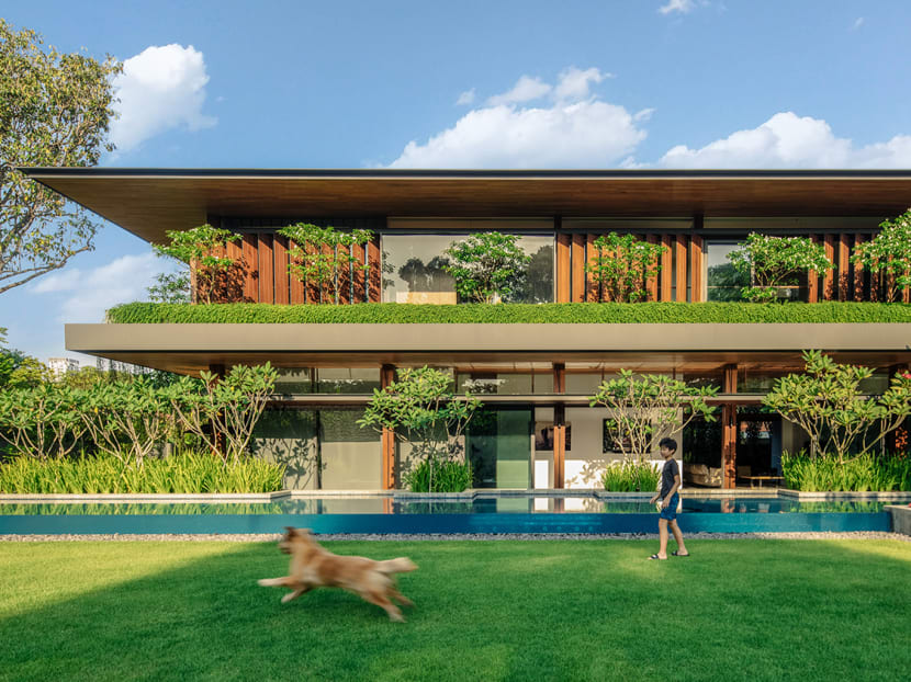 In Singapore, a good class bungalow with luxuriant landscaping – and a beautiful basement garage