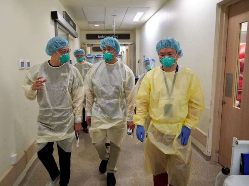 Health Minister Ong Ye Kung (centre) during a visit to the Ng Teng Fong General Hospital. 