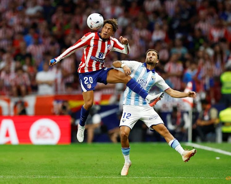 Atletico Madrid beat Malaga but Alvarez absence is felt