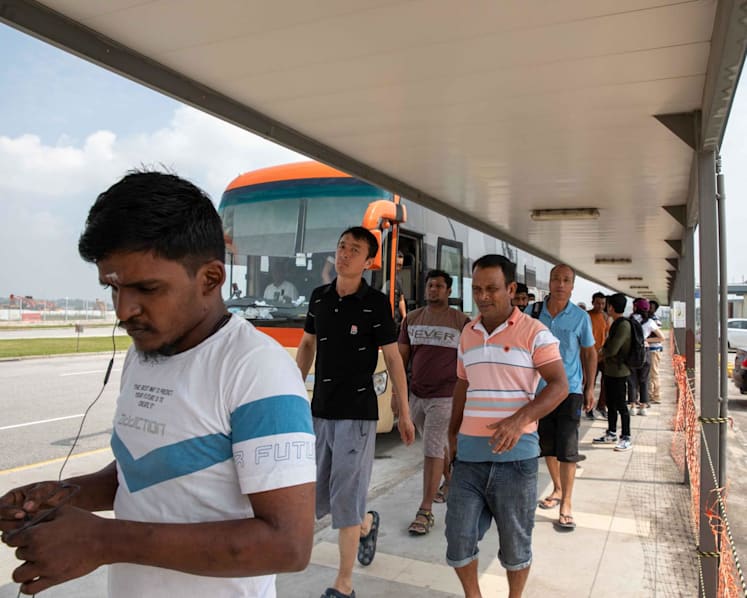Migrant workers at Tanah Merah dorm have to wait hours for shuttle bus; operator says it's only a peak-period problem