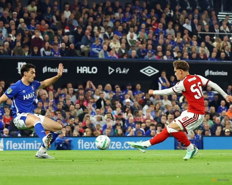 Teenager Dowman scores twice as Arsenal progress in League Cup